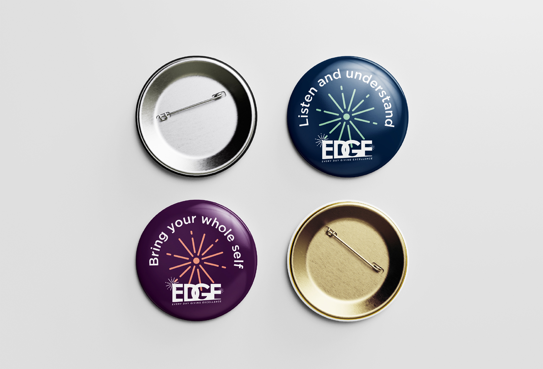 Navy and plum Broadgate EDGE appreciation badges, shown with their metal backs